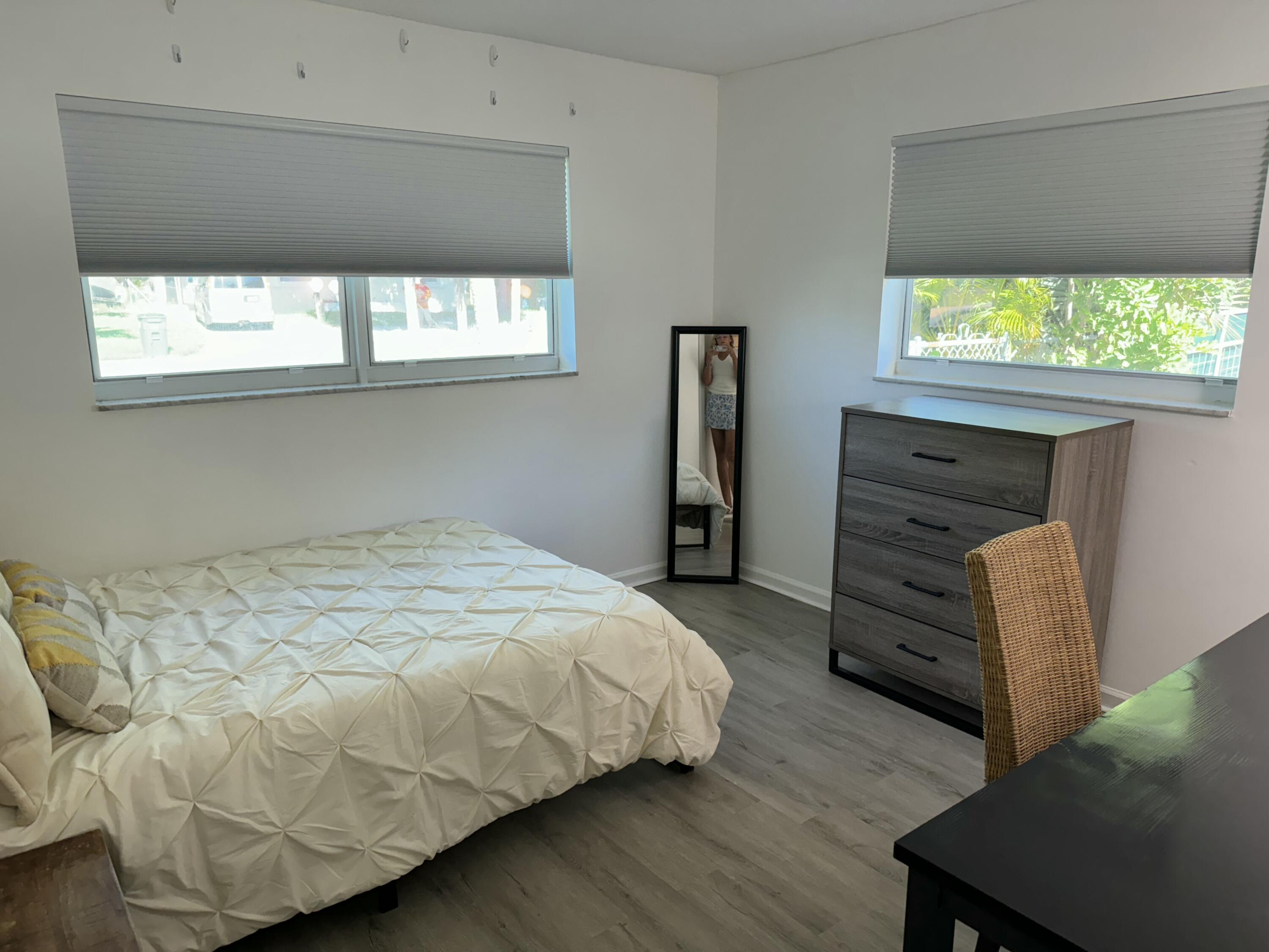 4600 Northeast 4th Avenue Boca Raton, FL 33431 - Photo 17 of 36 a bedroom with a bed and a window