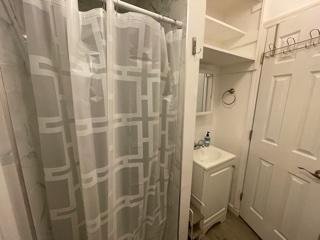 4600 Northeast 4th Avenue Boca Raton, FL 33431 - Photo 22 of 36 a bathroom with a shower and a sink