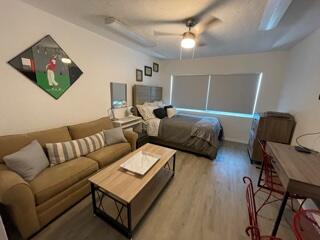 4600 Northeast 4th Avenue Boca Raton, FL 33431 - Photo 23 of 36 a living room with furniture and a flat screen tv
