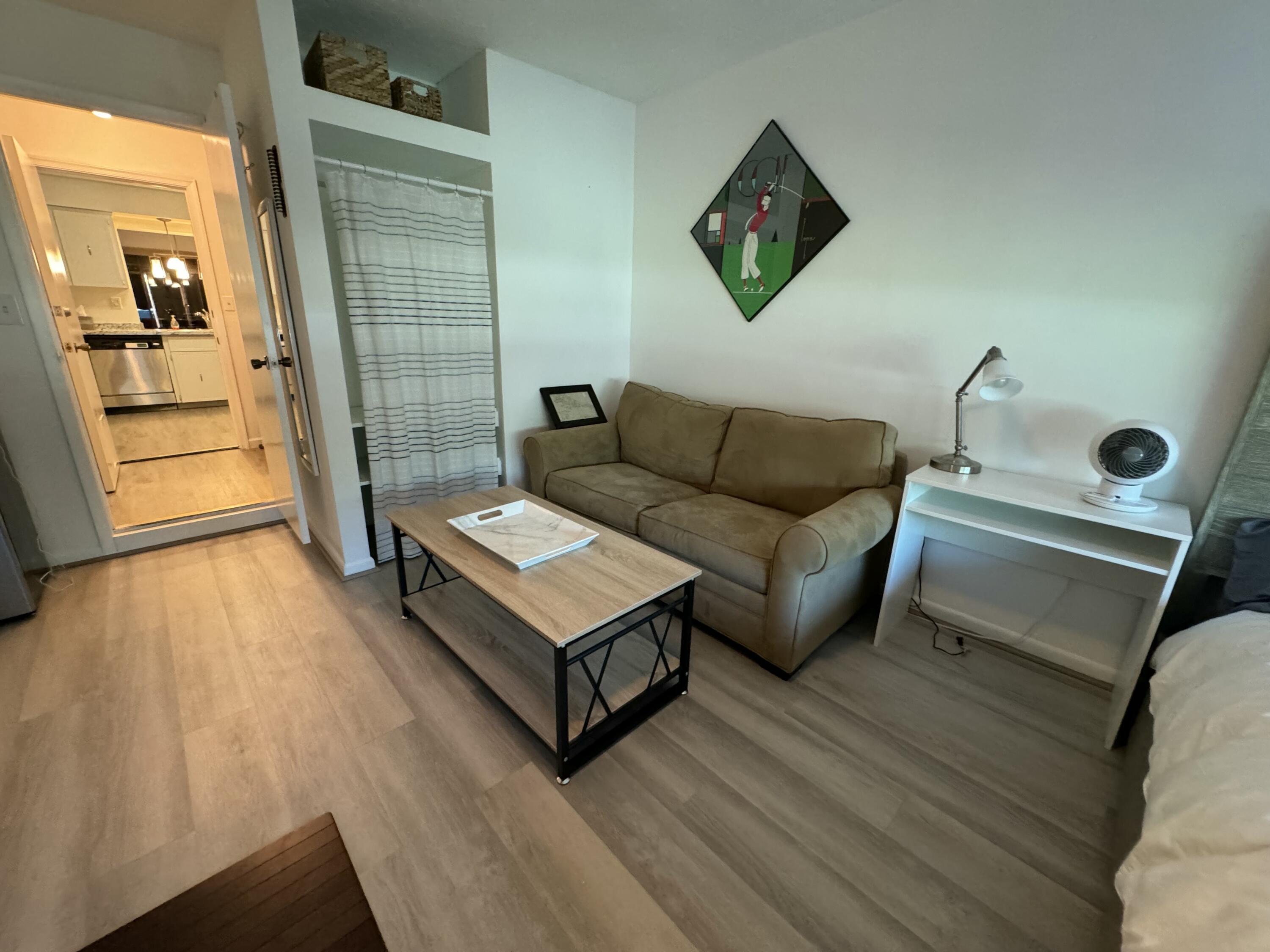 4600 Northeast 4th Avenue Boca Raton, FL 33431 - Photo 24 of 36 a living room with furniture and a wooden floor