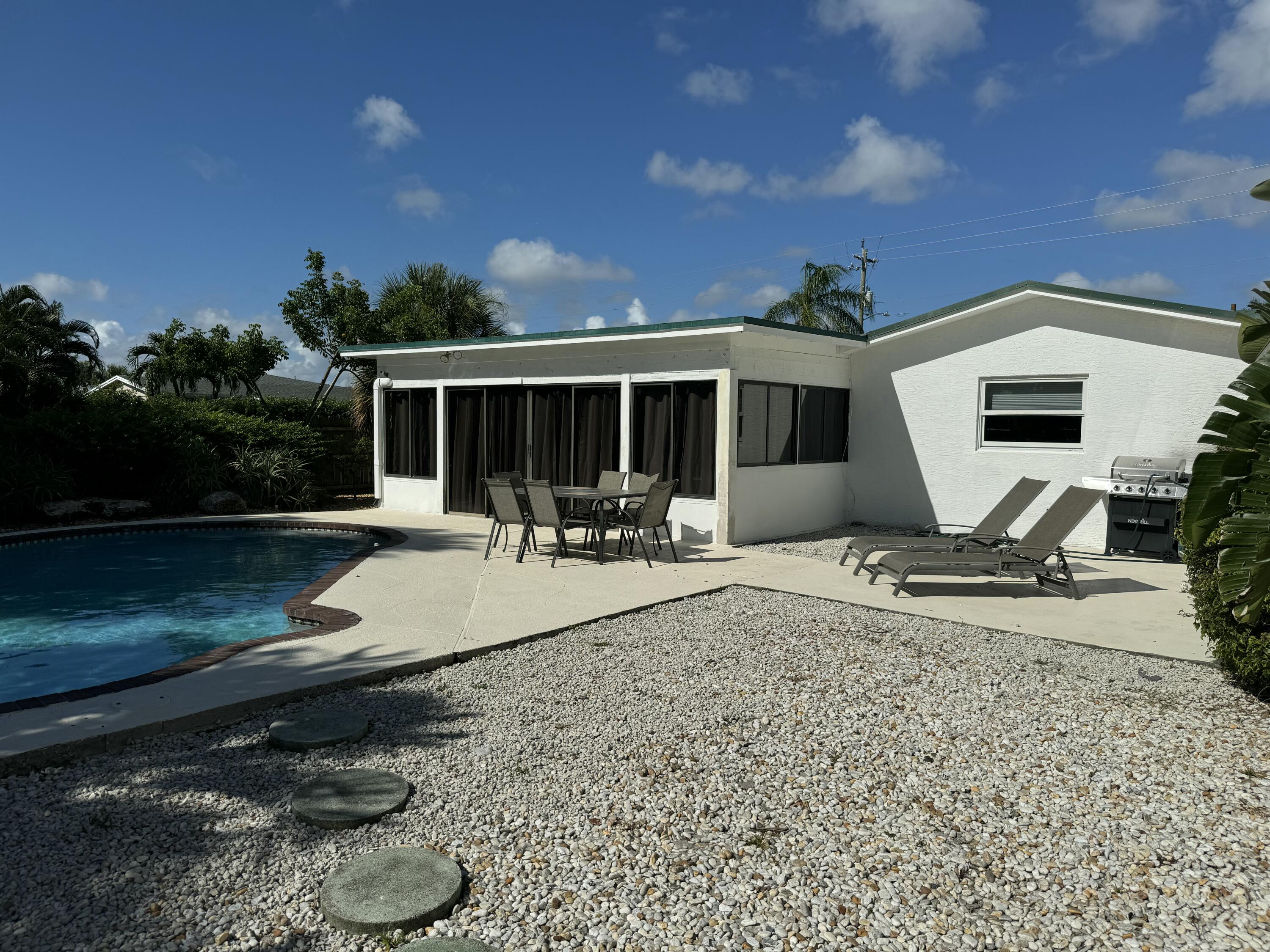4600 Northeast 4th Avenue Boca Raton, FL 33431 - Photo 27 of 36 a view of a backyard with sitting area and furniture