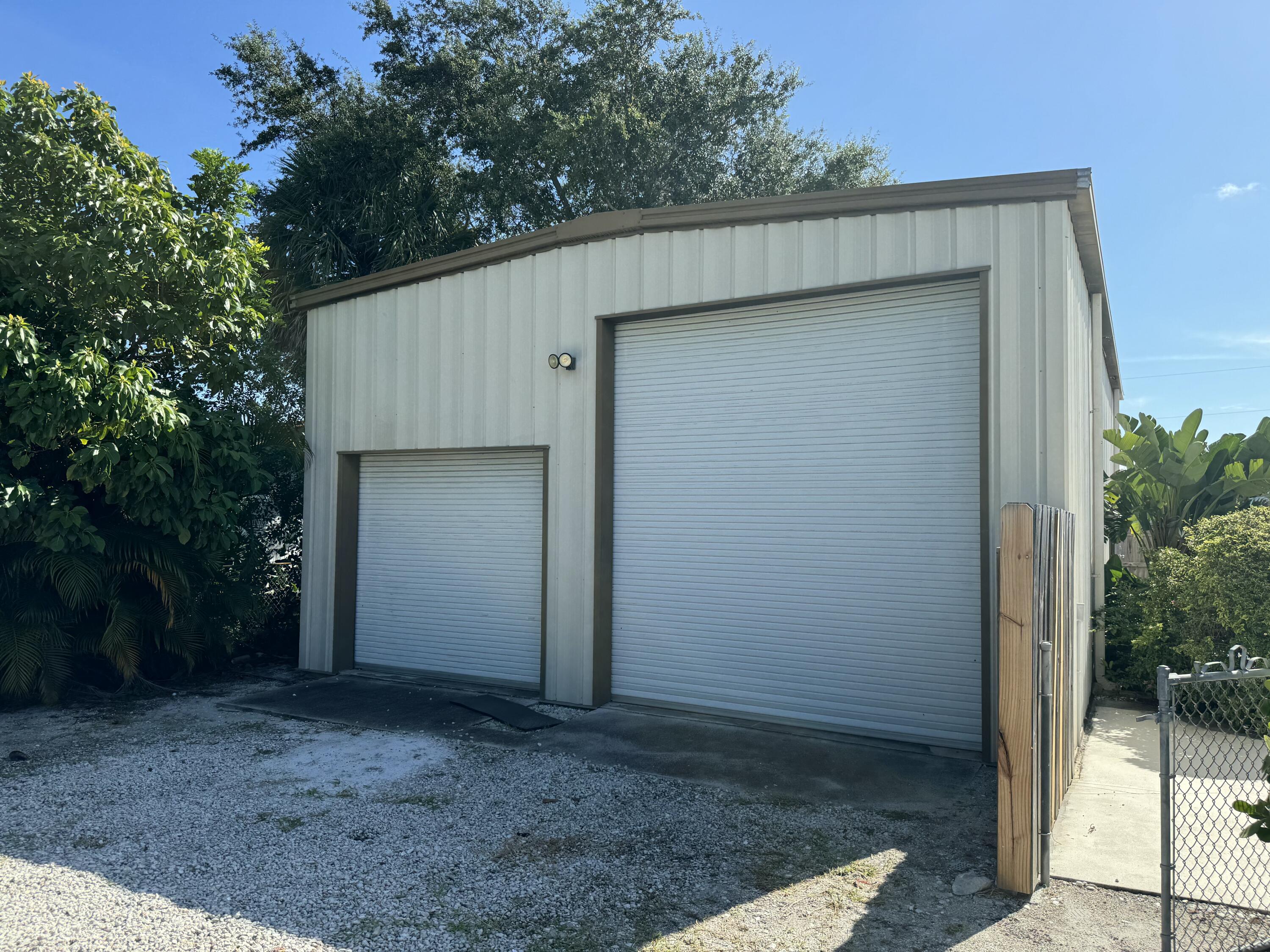 4600 Northeast 4th Avenue Boca Raton, FL 33431 - Photo 29 of 36 a view of a house with a garage