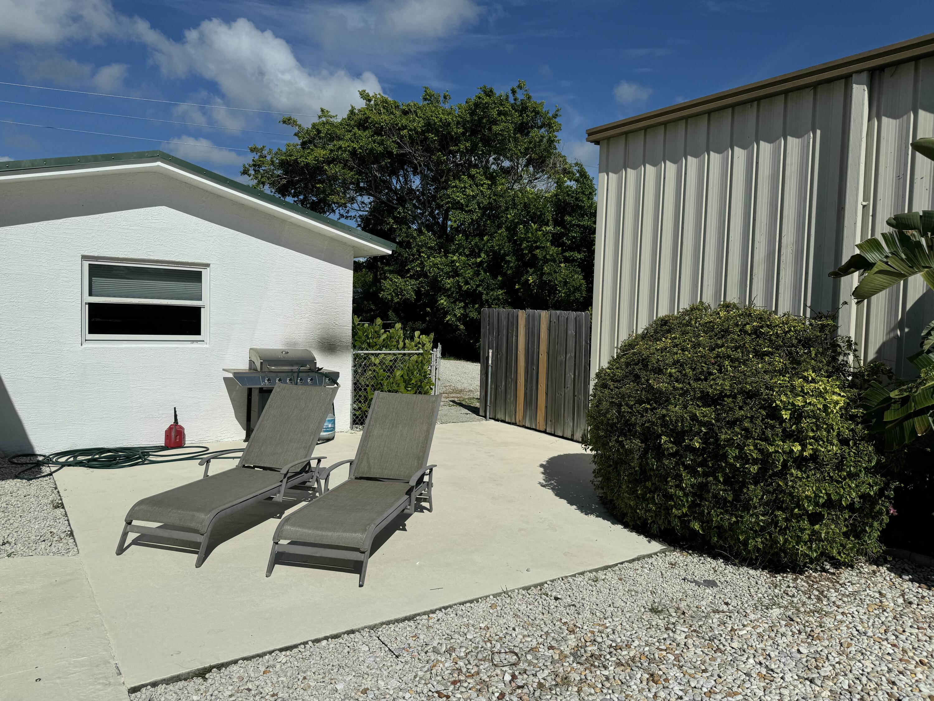 4600 Northeast 4th Avenue Boca Raton, FL 33431 - Photo 30 of 36 a backyard of a house with seating space