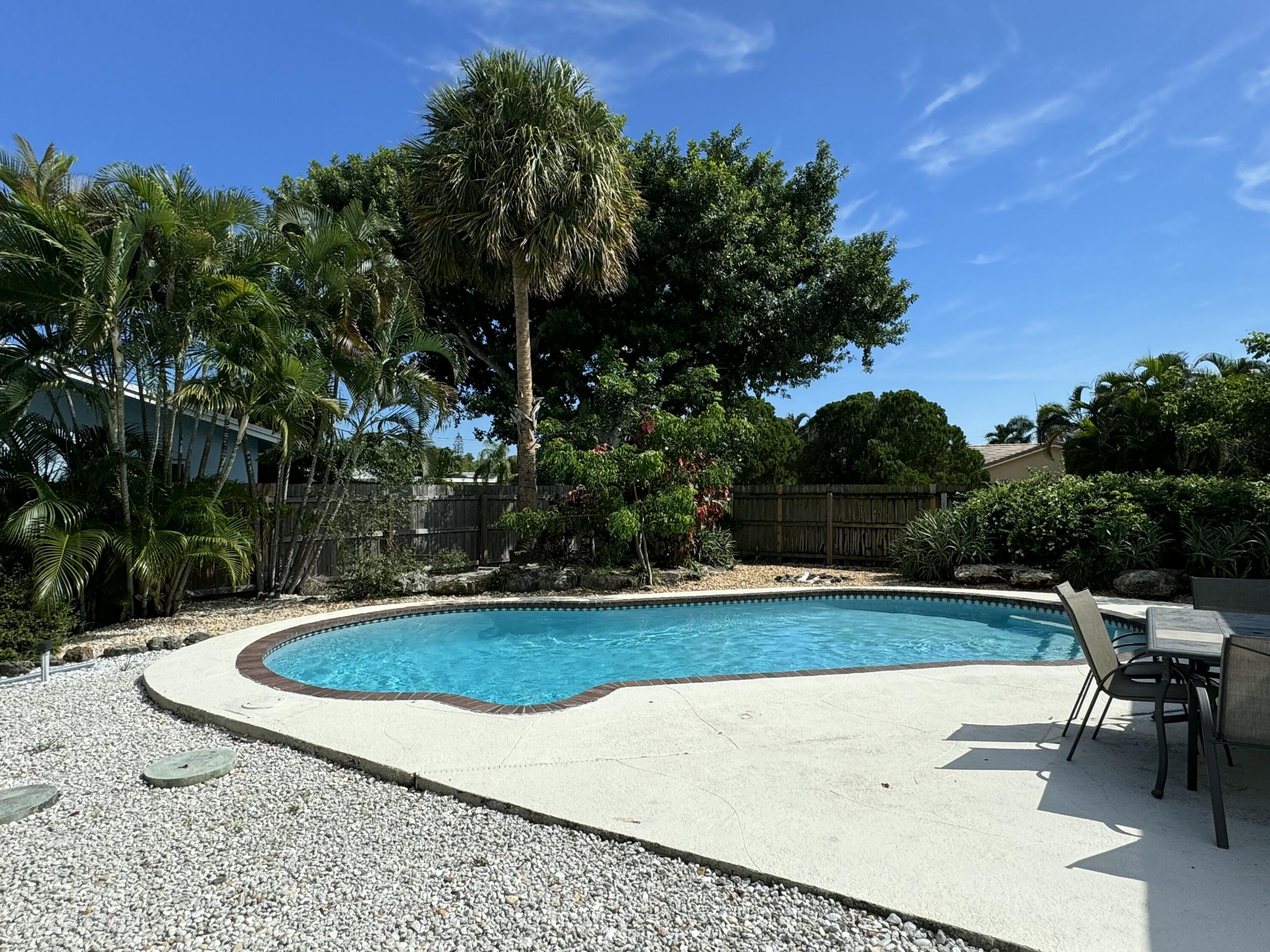 4600 Northeast 4th Avenue Boca Raton, FL 33431 - Photo 35 of 36 a view of a swimming pool and sitting area