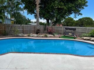 4600 Northeast 4th Avenue Boca Raton, FL 33431 - Photo 36 of 36 a view of a backyard with wooden fence
