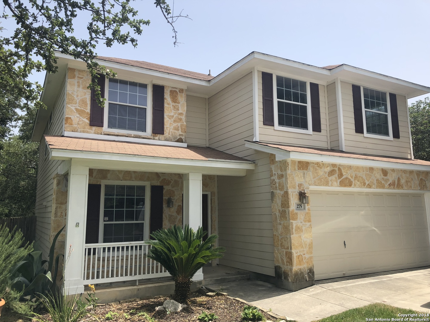 a front view of a house with a porch