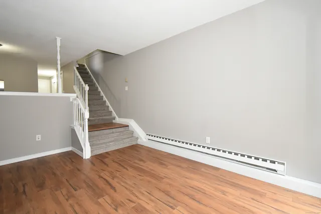 a view of entryway with wooden floor