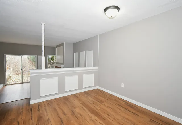 a view of kitchen with wooden floor and window