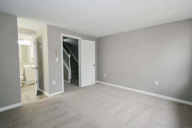 a view of an empty room and closet