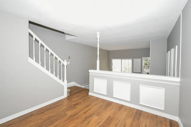 a view of entryway with wooden floor