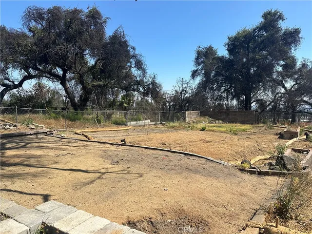 a view of a yard with snow on the road