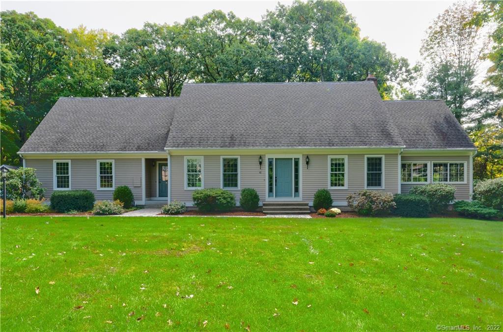 41 Enrico Road Bolton, CT 06043 - Photo 1 of 1 a front view of a house with a garden and porch