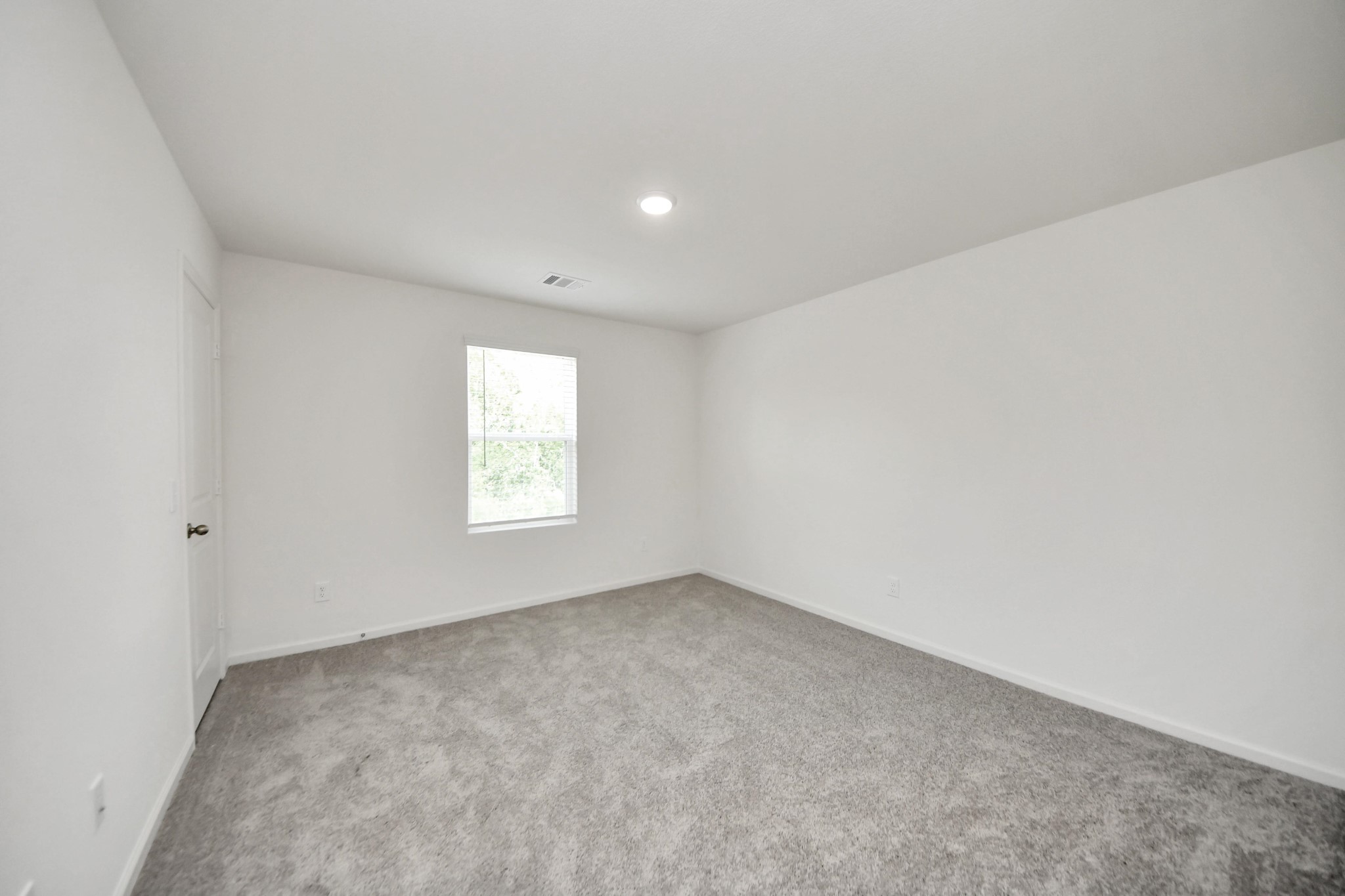 10303 Rose Mar Drive, Unit B Rosharon, TX 77583 - Photo 24 of 49 an empty room with a window