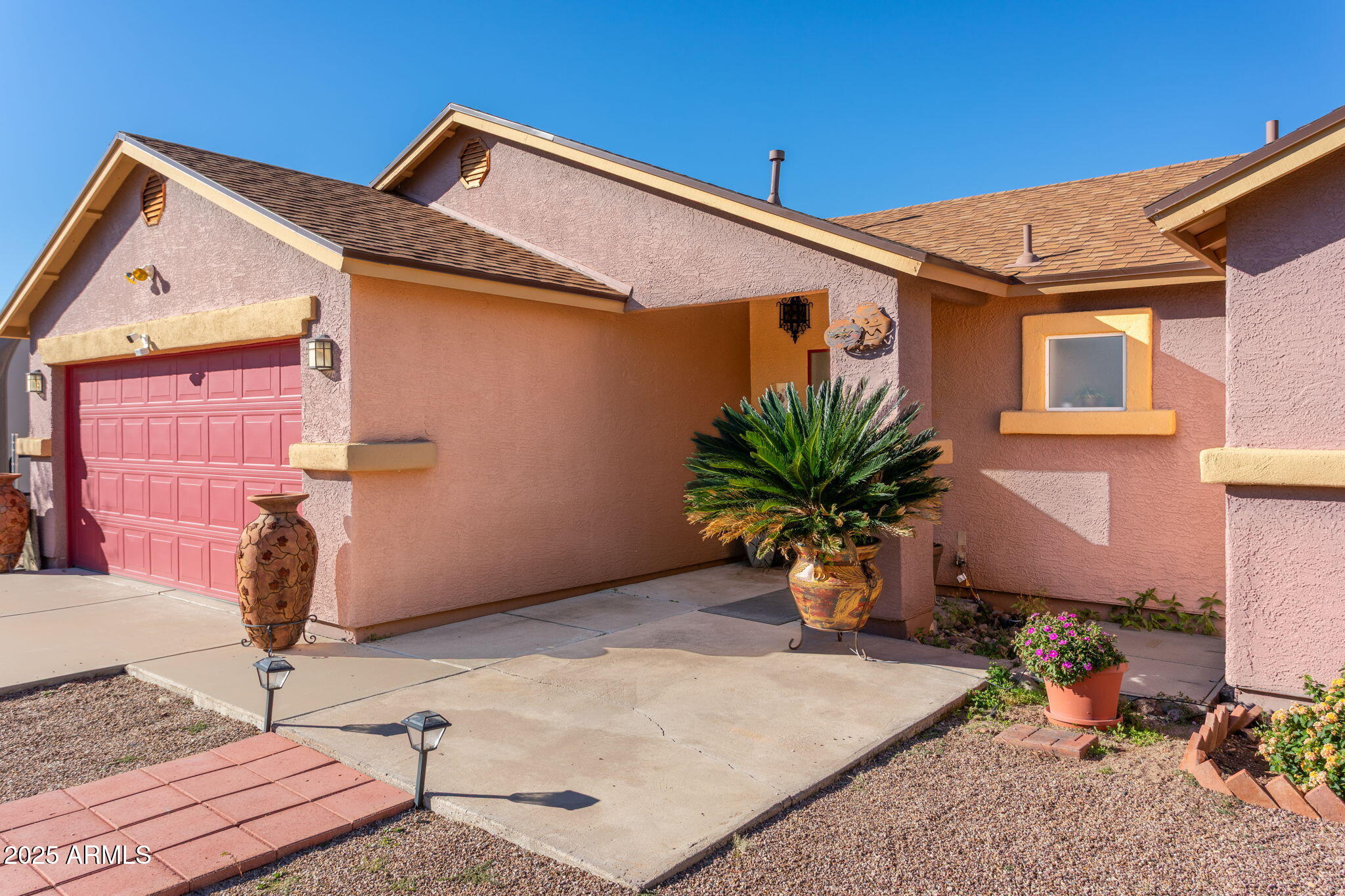 418 Cancun Court Rio Rico, AZ 85648 - Photo 1 of 36 a front view of a house with garden