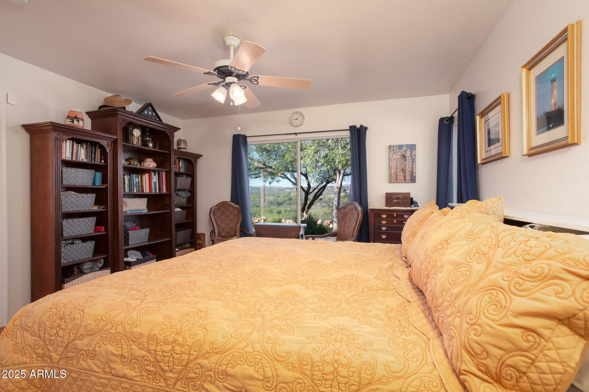 418 Cancun Court Rio Rico, AZ 85648 - Photo 16 of 36 a large bedroom with a bed cabinets and window