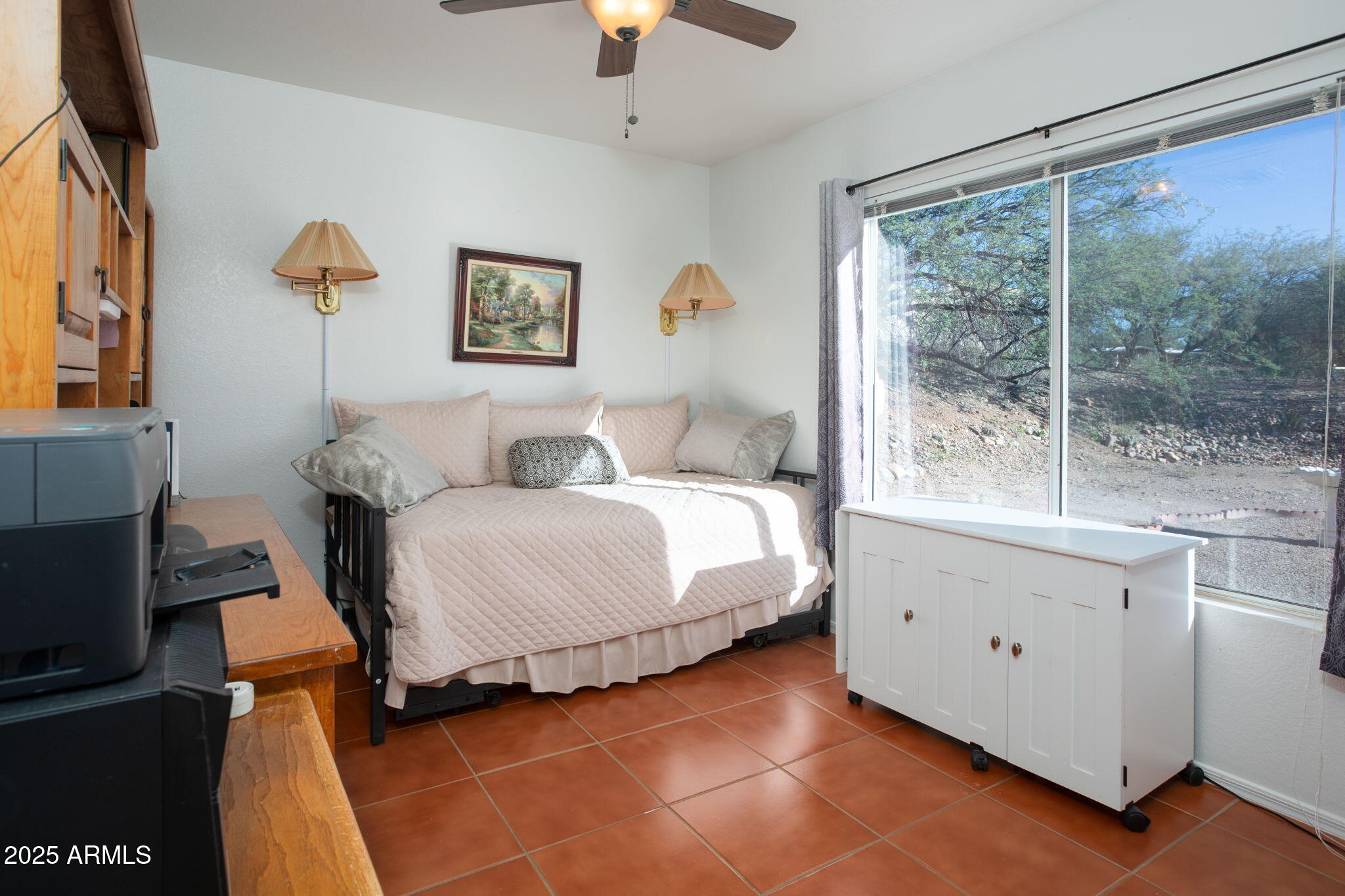 418 Cancun Court Rio Rico, AZ 85648 - Photo 20 of 36 a bedroom with a large bed and a window