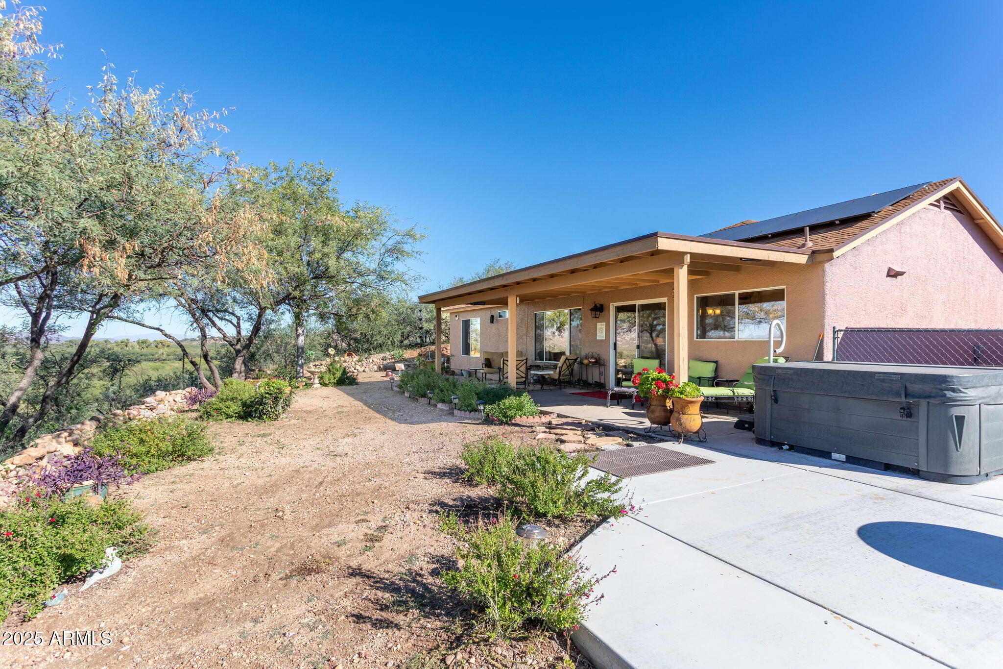 418 Cancun Court Rio Rico, AZ 85648 - Photo 25 of 36 a view of a house with backyard and sitting area