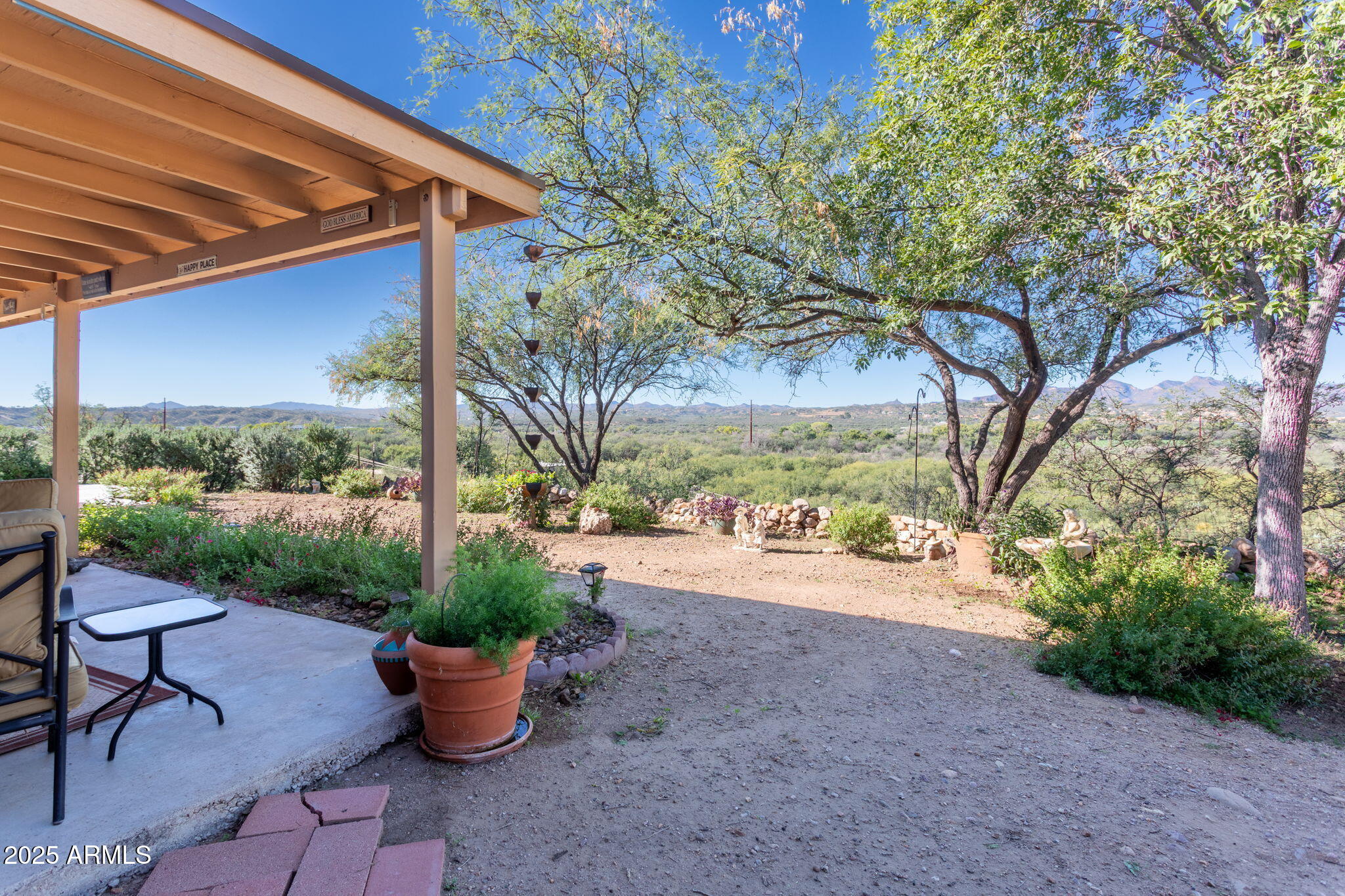 418 Cancun Court Rio Rico, AZ 85648 - Photo 30 of 36 a view of a patio with backyard and outdoor seating