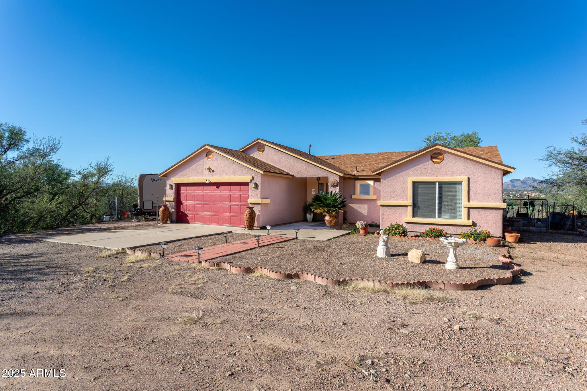 418 Cancun Court Rio Rico, AZ 85648 - Photo 3 of 36 a house view with a outdoor space