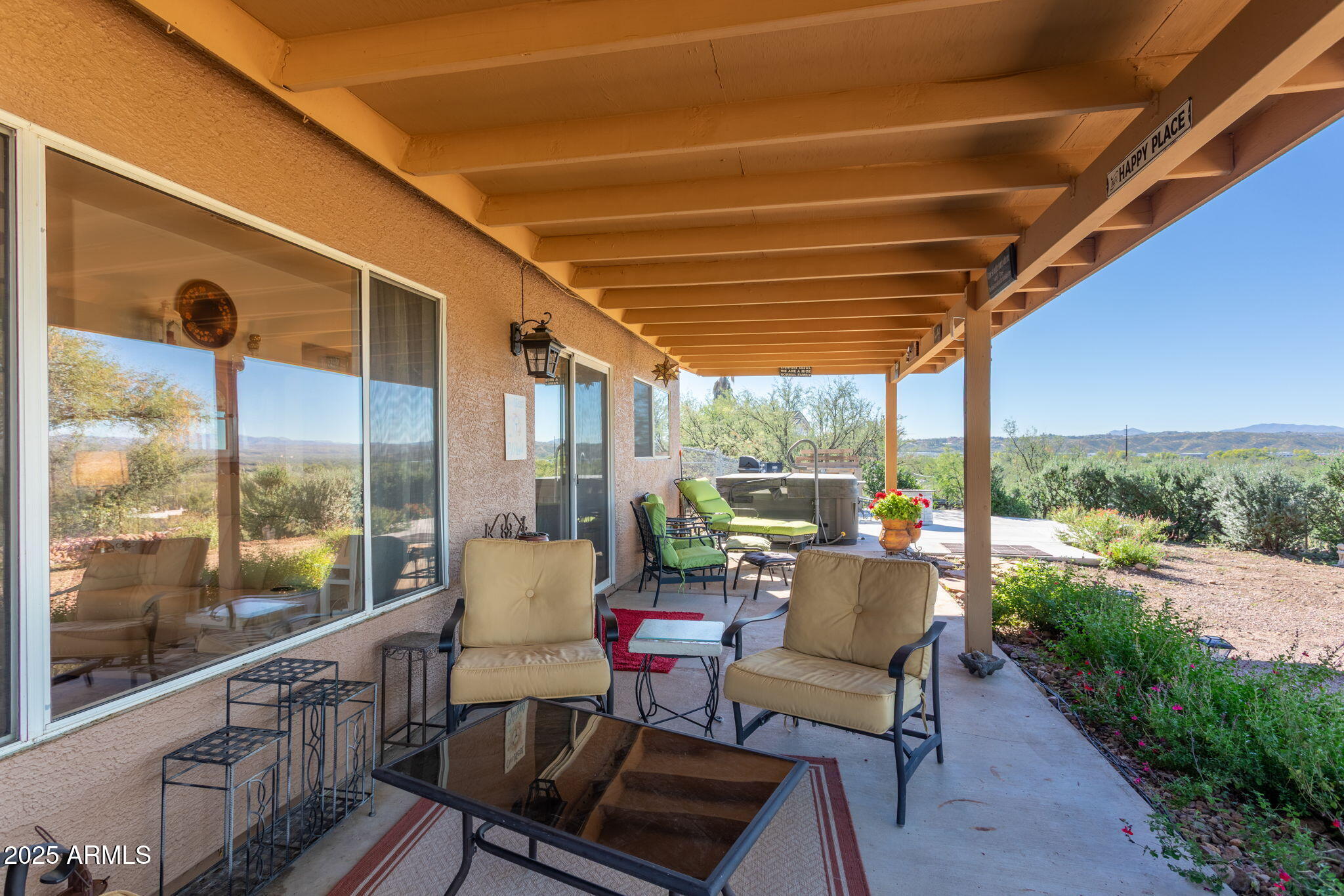 418 Cancun Court Rio Rico, AZ 85648 - Photo 31 of 36 a balcony with furniture and a garden