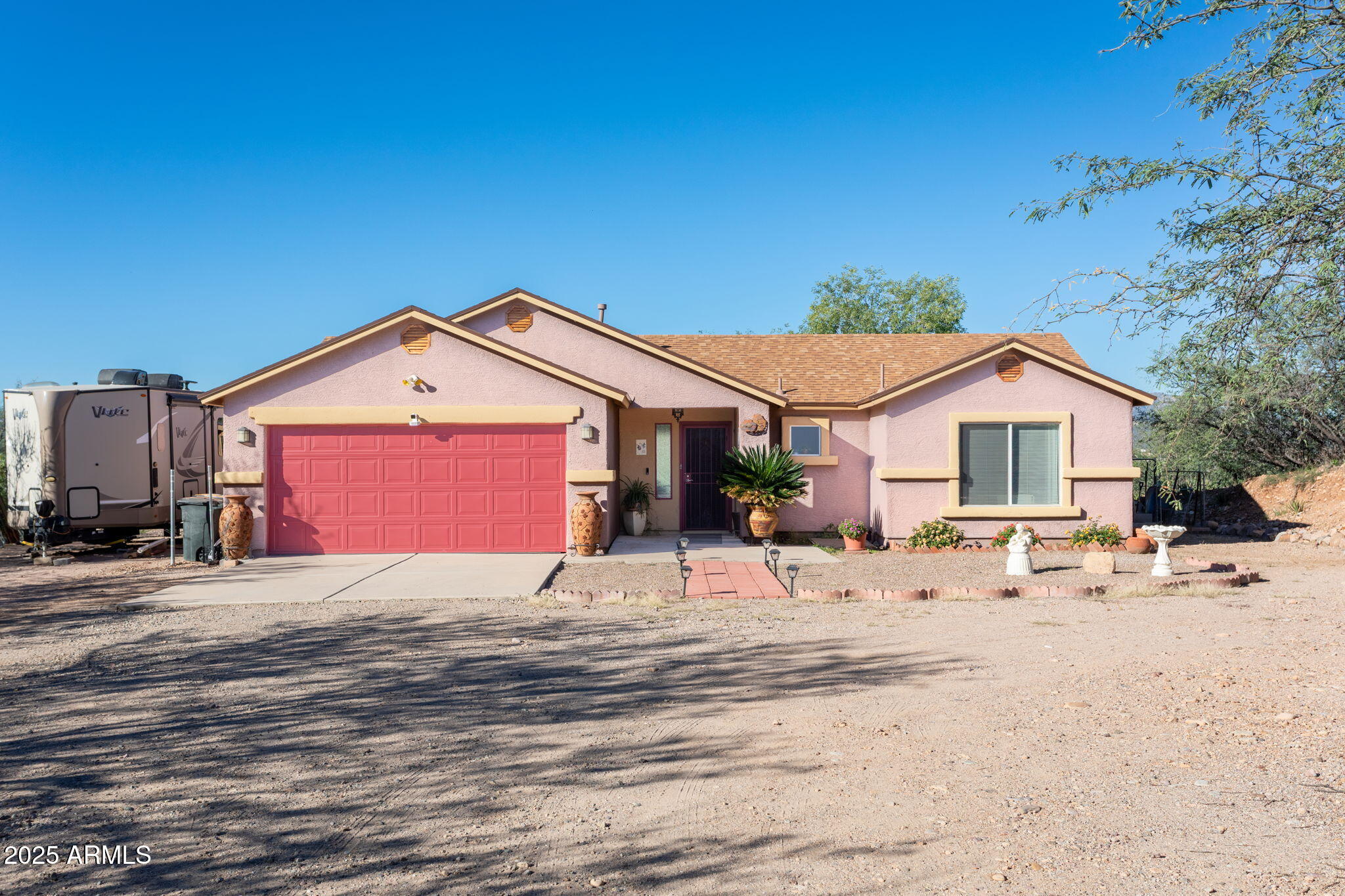 418 Cancun Court Rio Rico, AZ 85648 - Photo 35 of 36 a big house with wooden fence in front of it