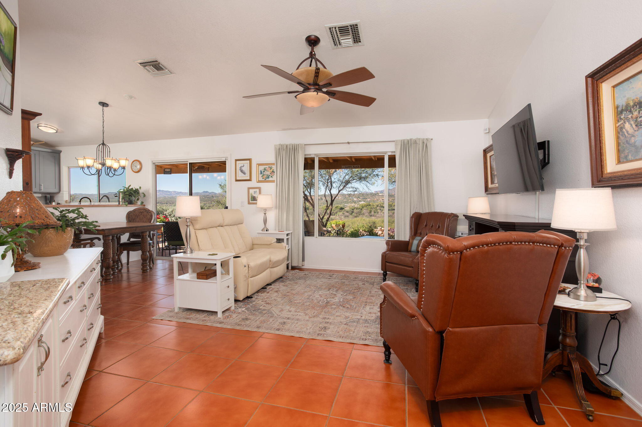 418 Cancun Court Rio Rico, AZ 85648 - Photo 7 of 36 a living room with furniture and a flat screen tv