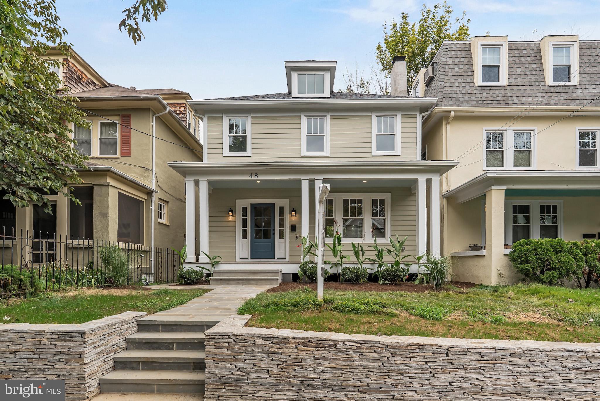 front view of a house with a yard