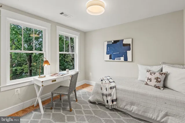 a bedroom with furniture and windows