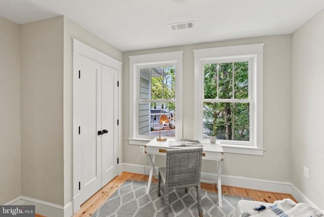 a room with chairs and window