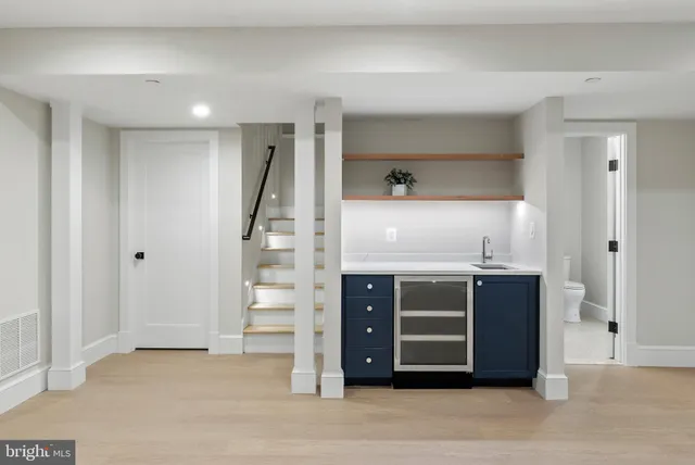 a view of walk in closet with a fireplace
