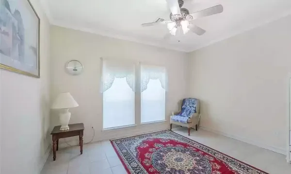 a living room with furniture and a rug