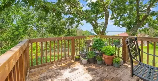 a view of a balcony with wooden floor