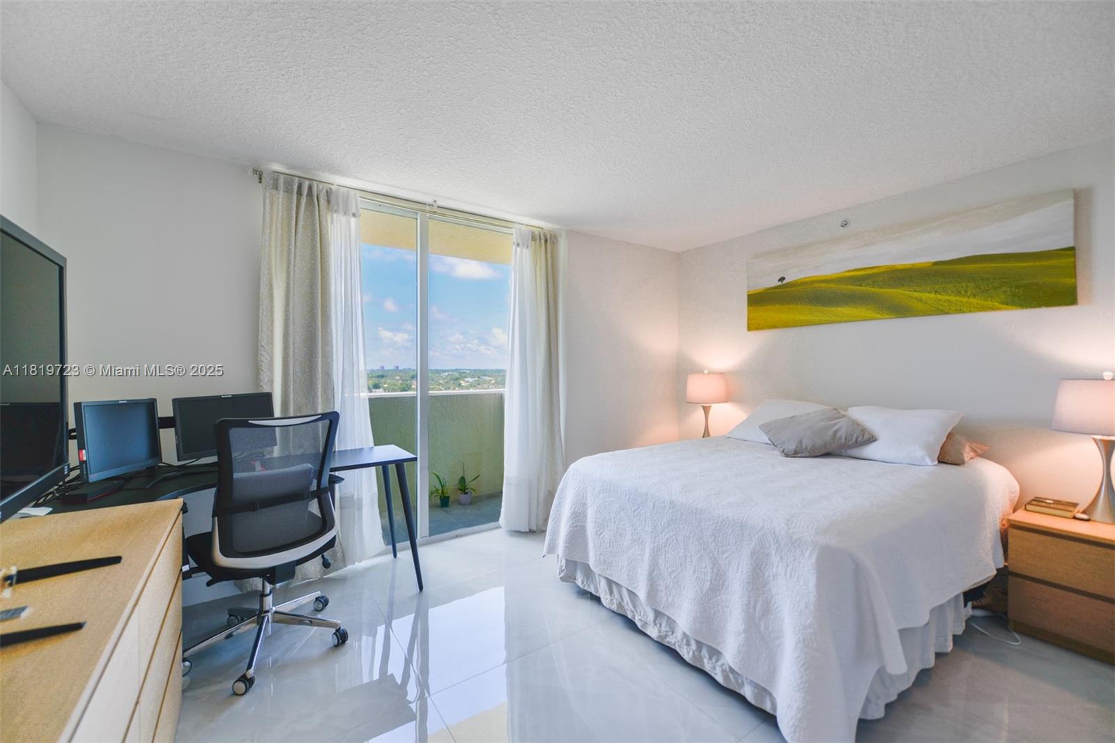 3000 Coral Way, Unit 1208 Miami, FL 33145 - Photo 13 of 35 a bedroom with a bed chair and computer on the desk
