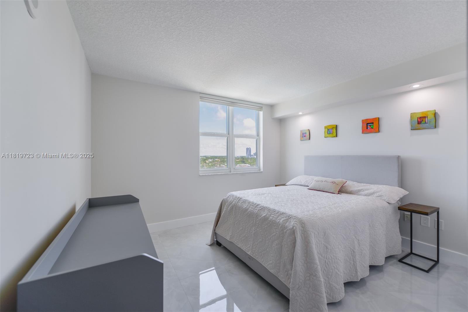 3000 Coral Way, Unit 1208 Miami, FL 33145 - Photo 17 of 35 a bedroom with a bed and window