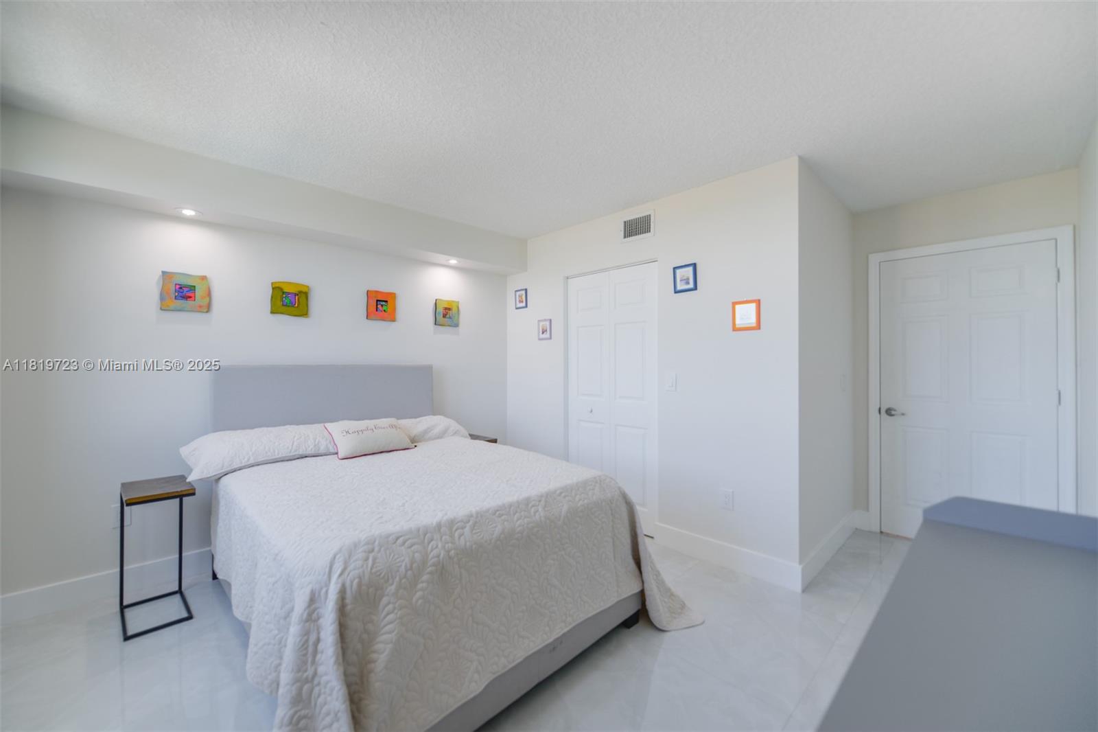 3000 Coral Way, Unit 1208 Miami, FL 33145 - Photo 18 of 35 a bedroom with a bed and a window