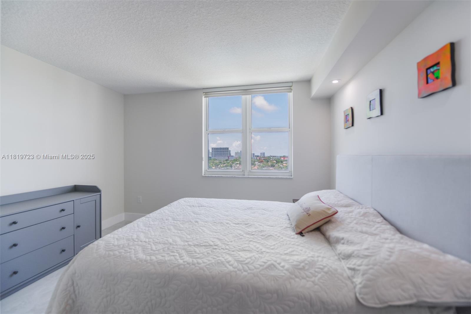 3000 Coral Way, Unit 1208 Miami, FL 33145 - Photo 19 of 35 a bedroom with a bed and a window