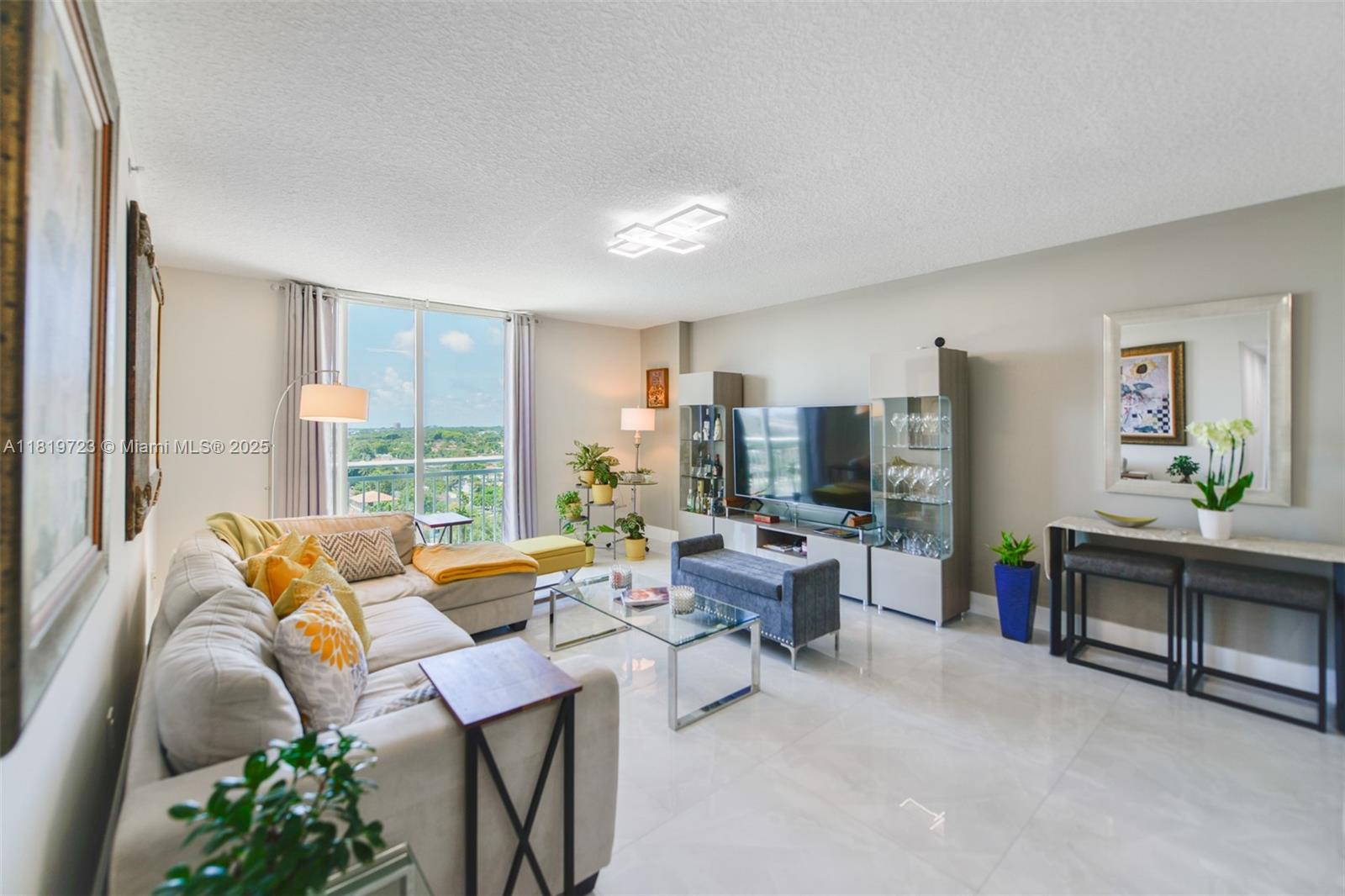 3000 Coral Way, Unit 1208 Miami, FL 33145 - Photo 2 of 35 a living room with furniture and a large window