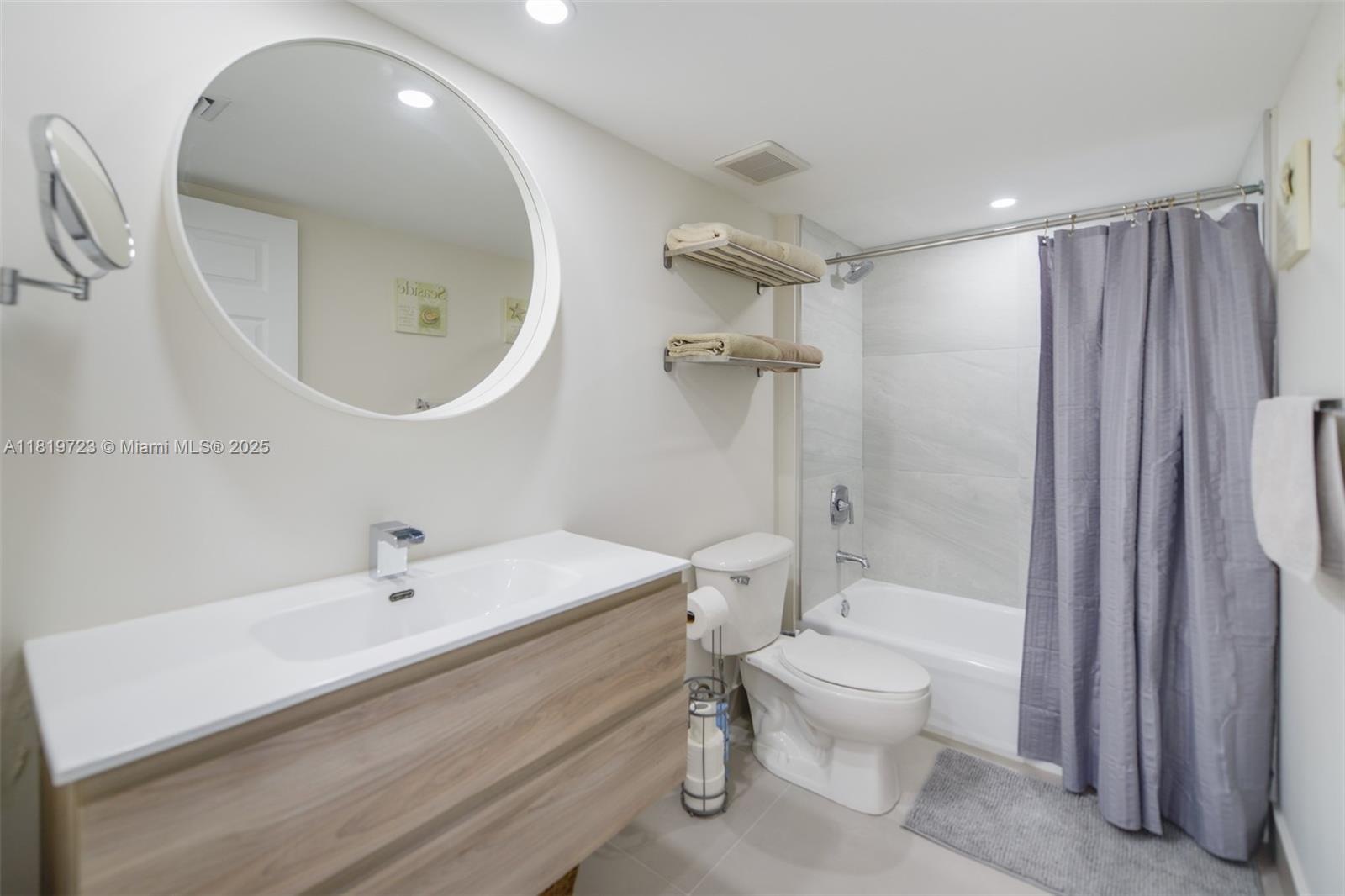3000 Coral Way, Unit 1208 Miami, FL 33145 - Photo 21 of 35 a bathroom with a sink a toilet and shower
