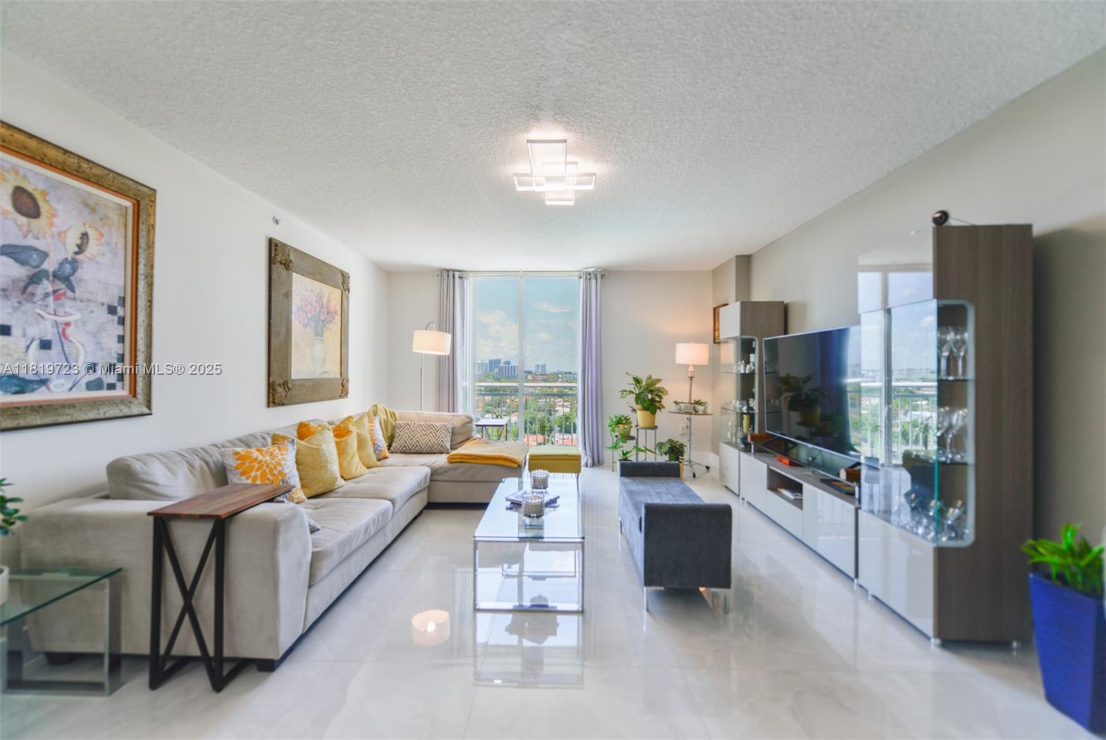 3000 Coral Way, Unit 1208 Miami, FL 33145 - Photo 3 of 35 a living room with furniture and a flat screen tv