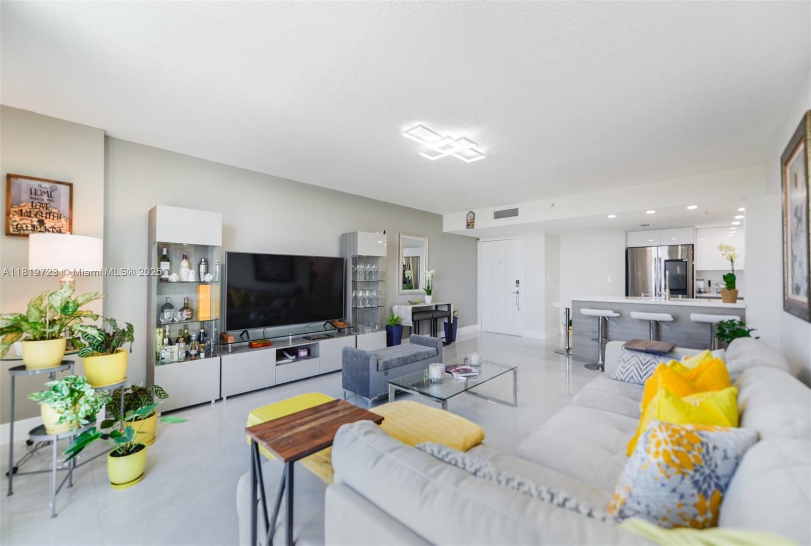 3000 Coral Way, Unit 1208 Miami, FL 33145 - Photo 5 of 35 a living room with furniture and a flat screen tv