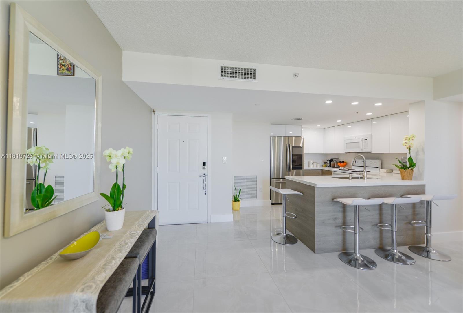 3000 Coral Way, Unit 1208 Miami, FL 33145 - Photo 6 of 35 a living room with furniture and a table