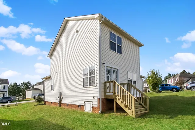 a view of backyard with deck