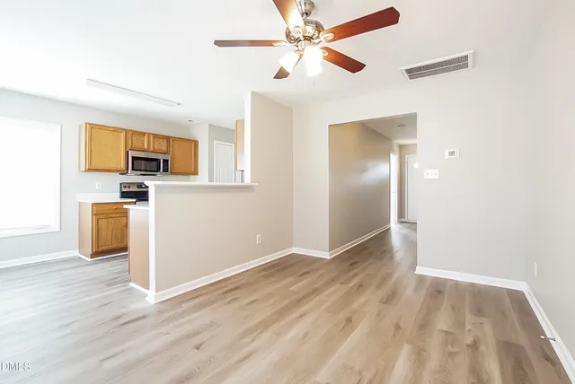 a view of a livingroom with wooden floor