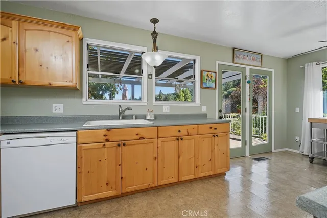 a bedroom with a bed dresser and window