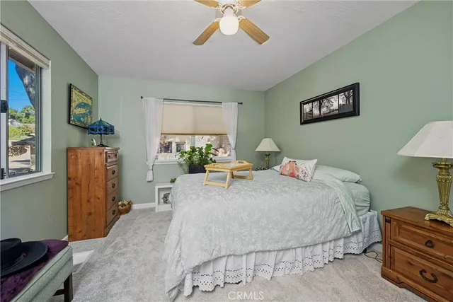 a living room with furniture and a lamp