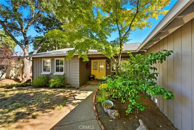 a front view of a house with outdoor seating