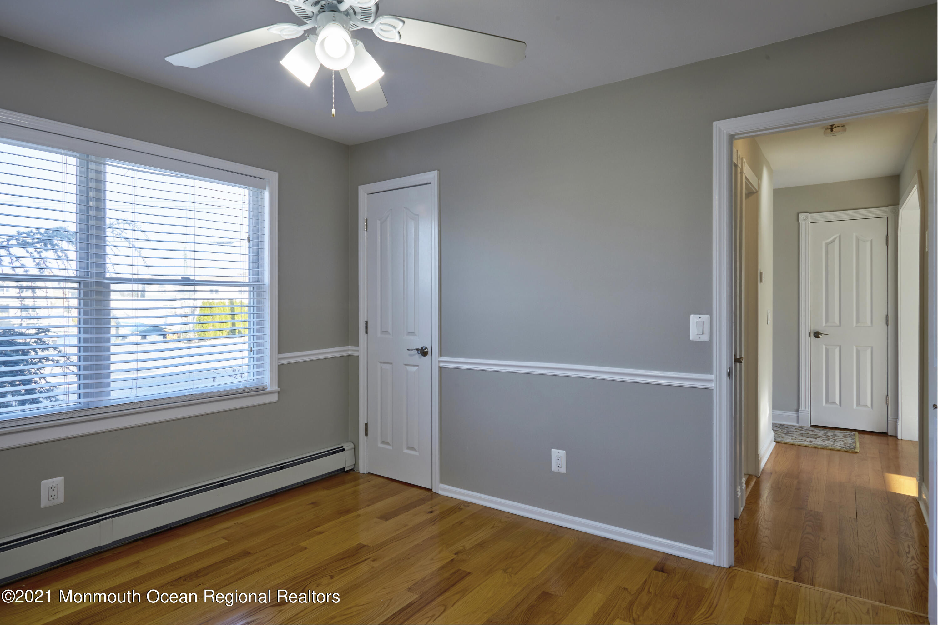 6 Topsail Road Brick, NJ 08723 - Photo 18 of 43 a view of an empty room with window and wooden floor