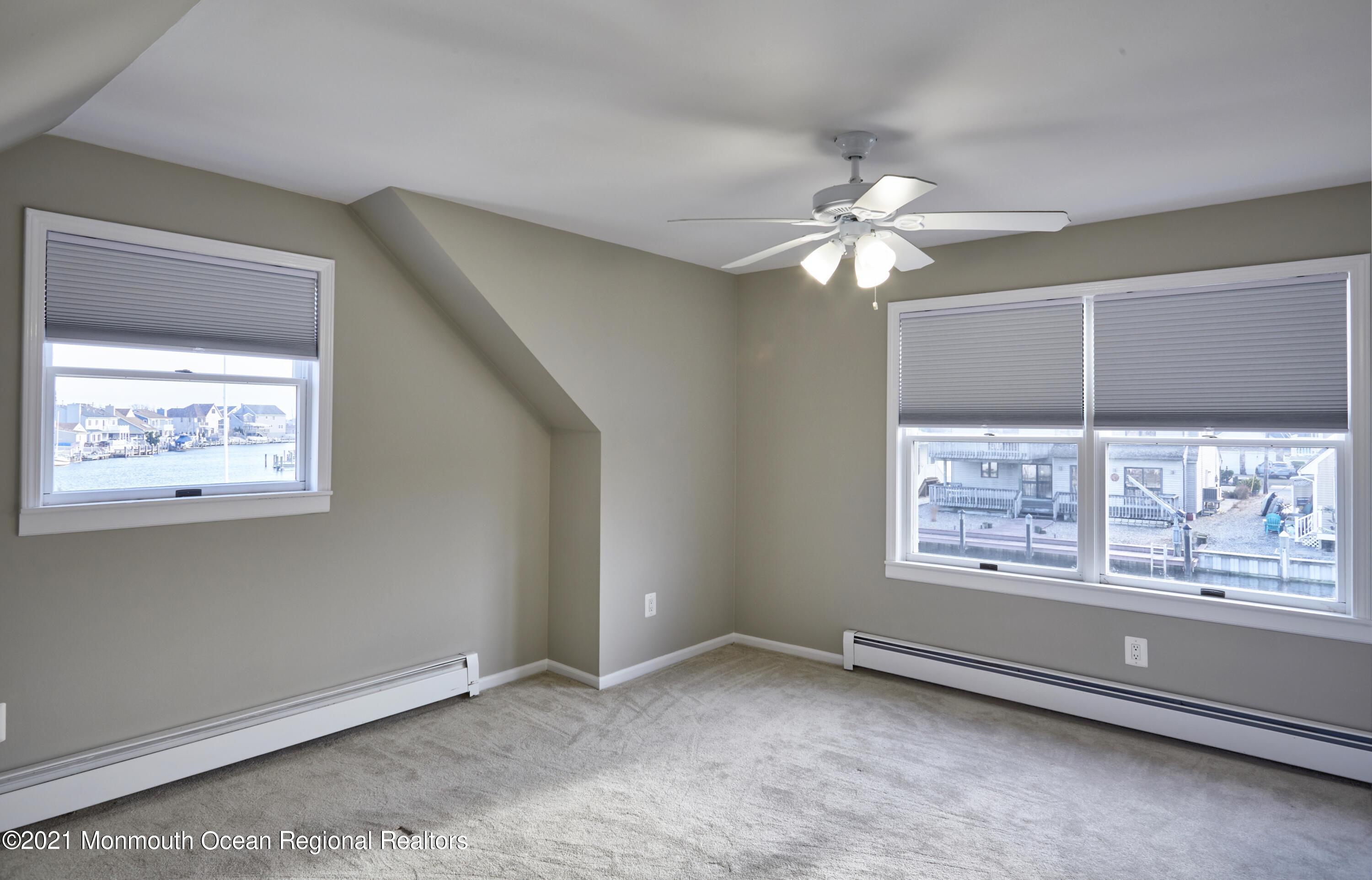 6 Topsail Road Brick, NJ 08723 - Photo 21 of 43 an empty room with windows and fan