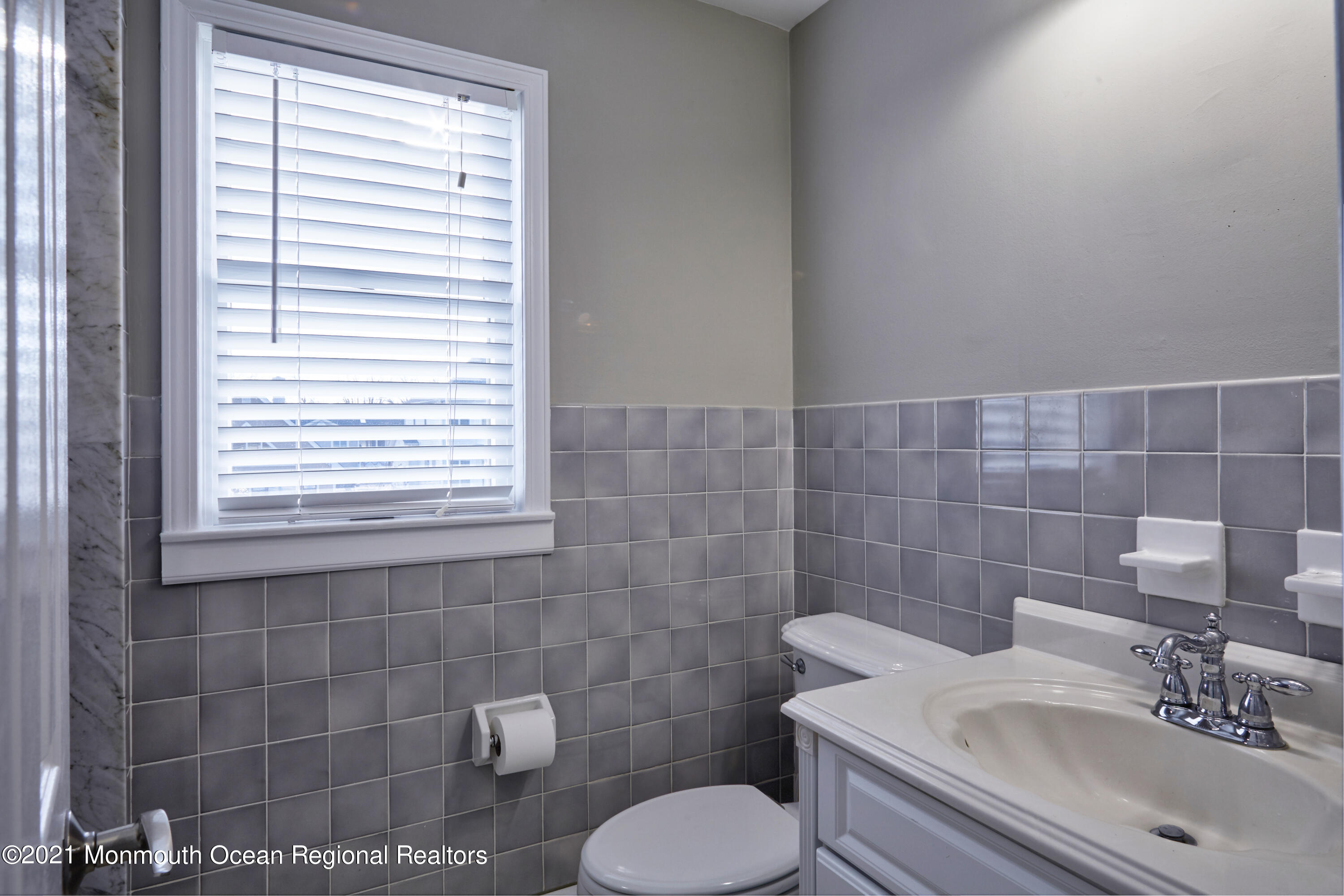 6 Topsail Road Brick, NJ 08723 - Photo 22 of 43 a bathroom with a sink a toilet and a window