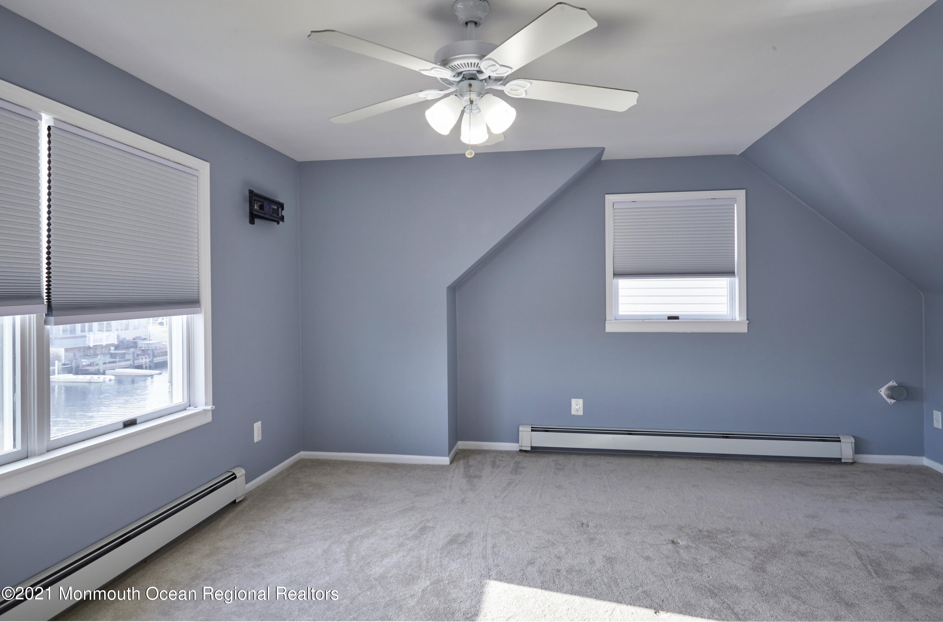 6 Topsail Road Brick, NJ 08723 - Photo 24 of 43 an empty room with windows and fan